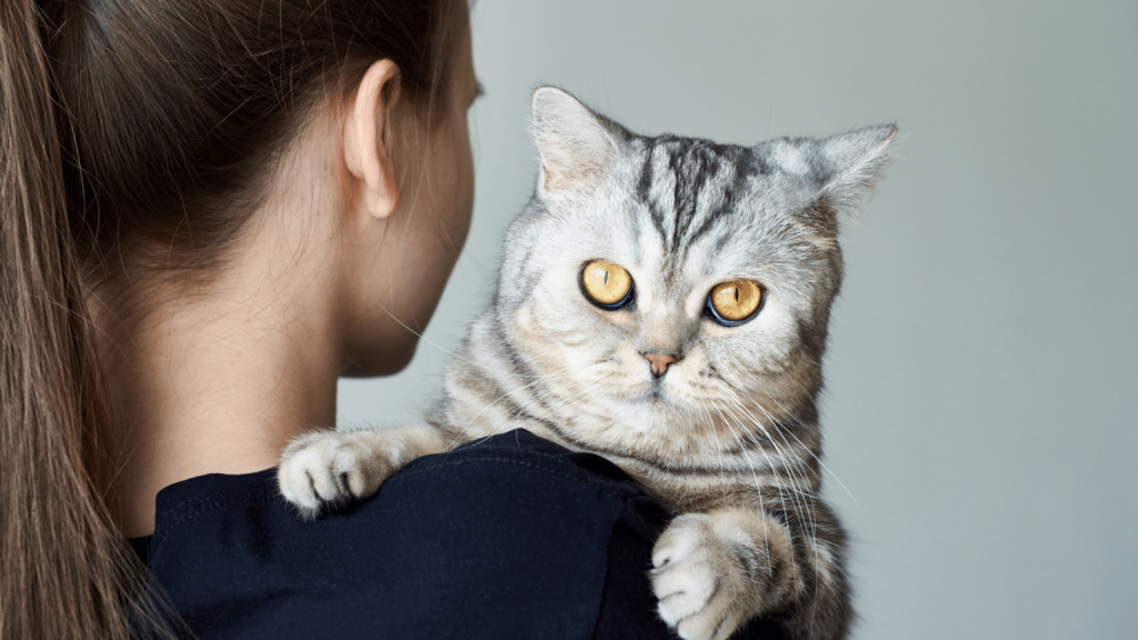 Image showing a woman and her cat.