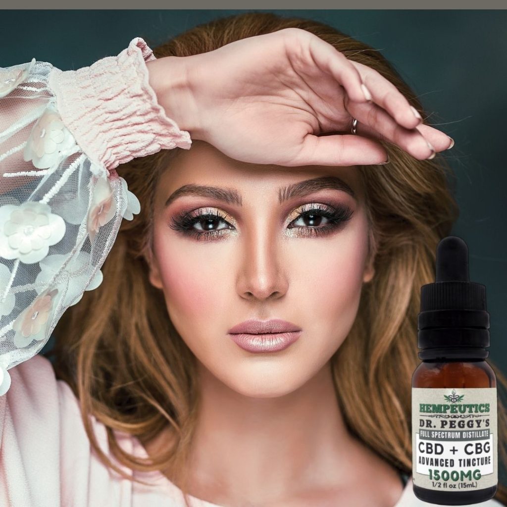 Image showing woman using Dr. Peggy's CBD + CBG advanced tincture for menopause.
