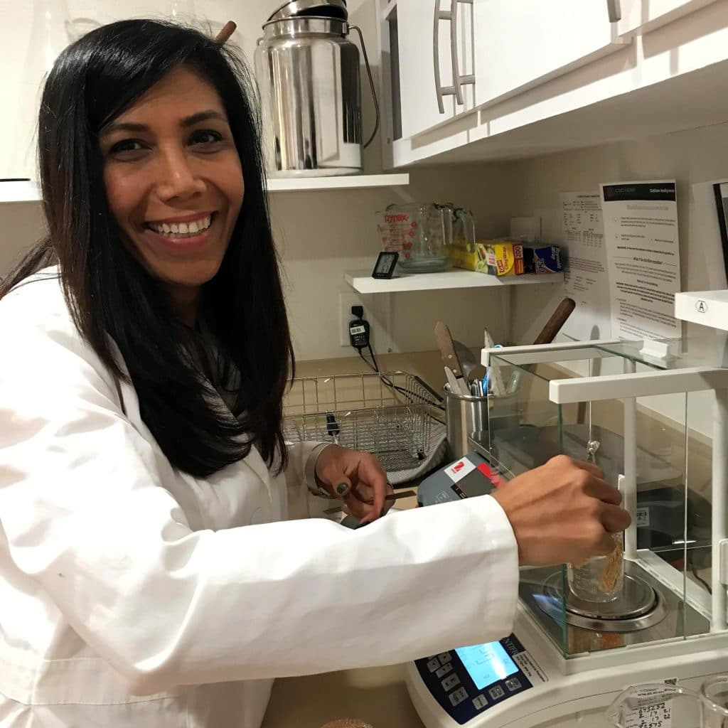 Pharmacist Dr. Peggy reviewing CBD formulations during product development