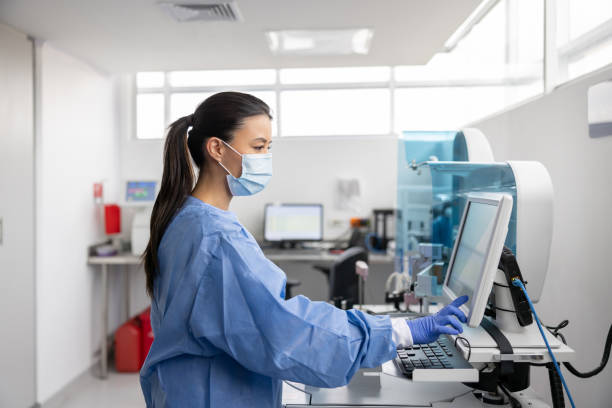 Image showing lab work being analyzed by technician.