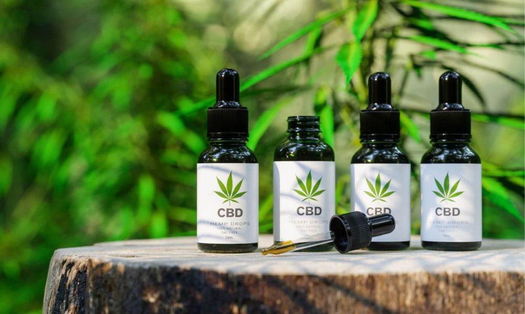 Bottles of CBD tinctures displayed as part of a pharmacist-formulated wellness product line