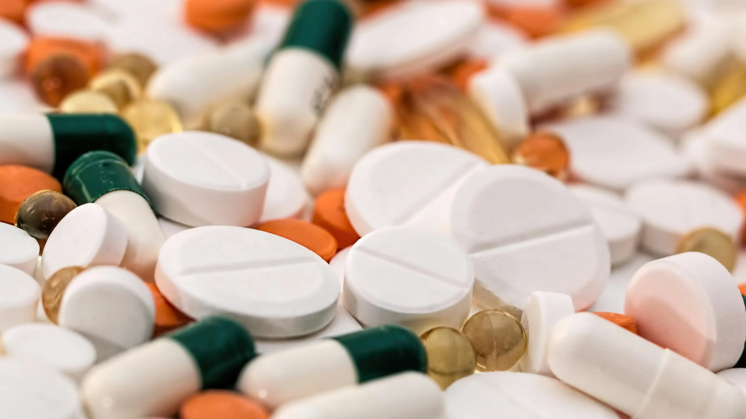 Prescription pain pills representing conventional pharmaceutical approaches to pain management.